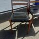 Scandinavian chairs in teak and black skaï.