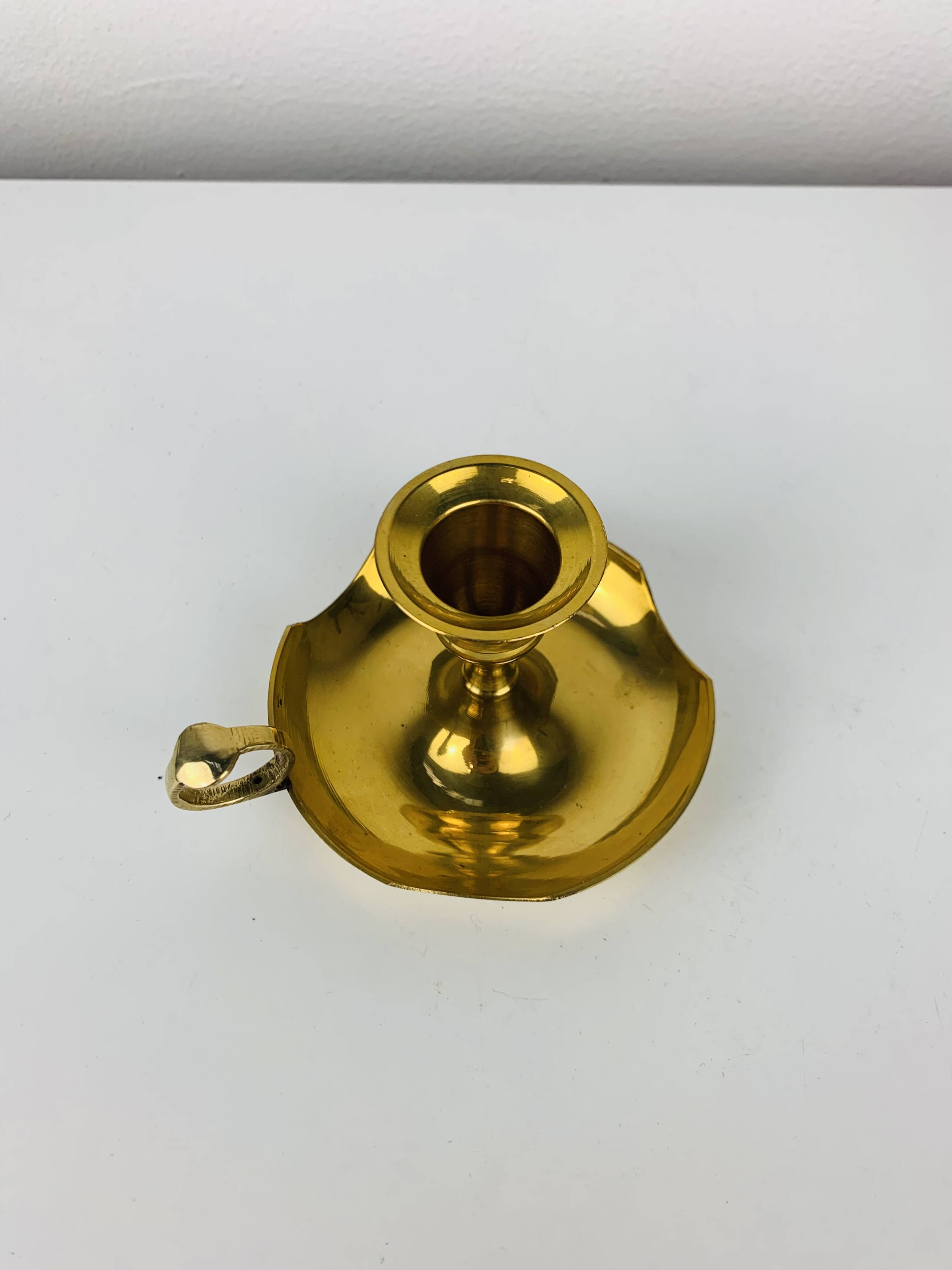 Golden brass candlestick rat of the cellar