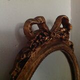 Miroir médaillon en bois doré - 43x24cm