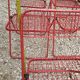 Set of 5 vintage red metal mesh folding chairs, Ted Net style.