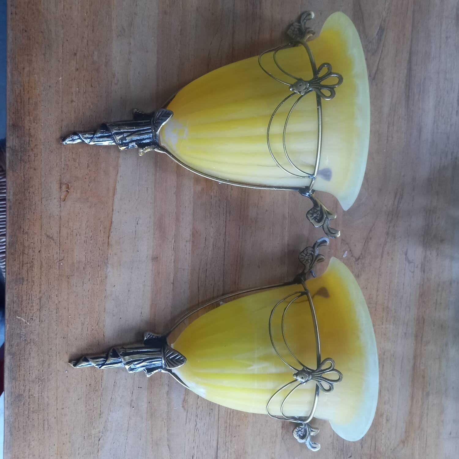 Art deco bronze wall lights with yellow glass