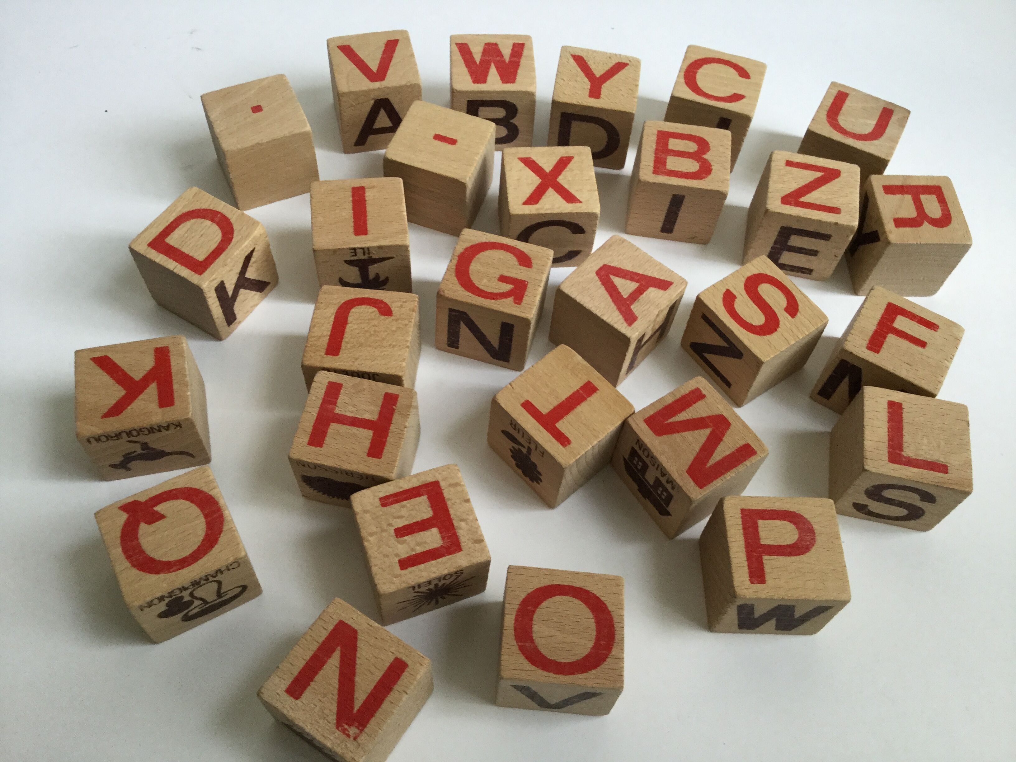 Ancient wooden toy cubes alphabet, figures and pictures