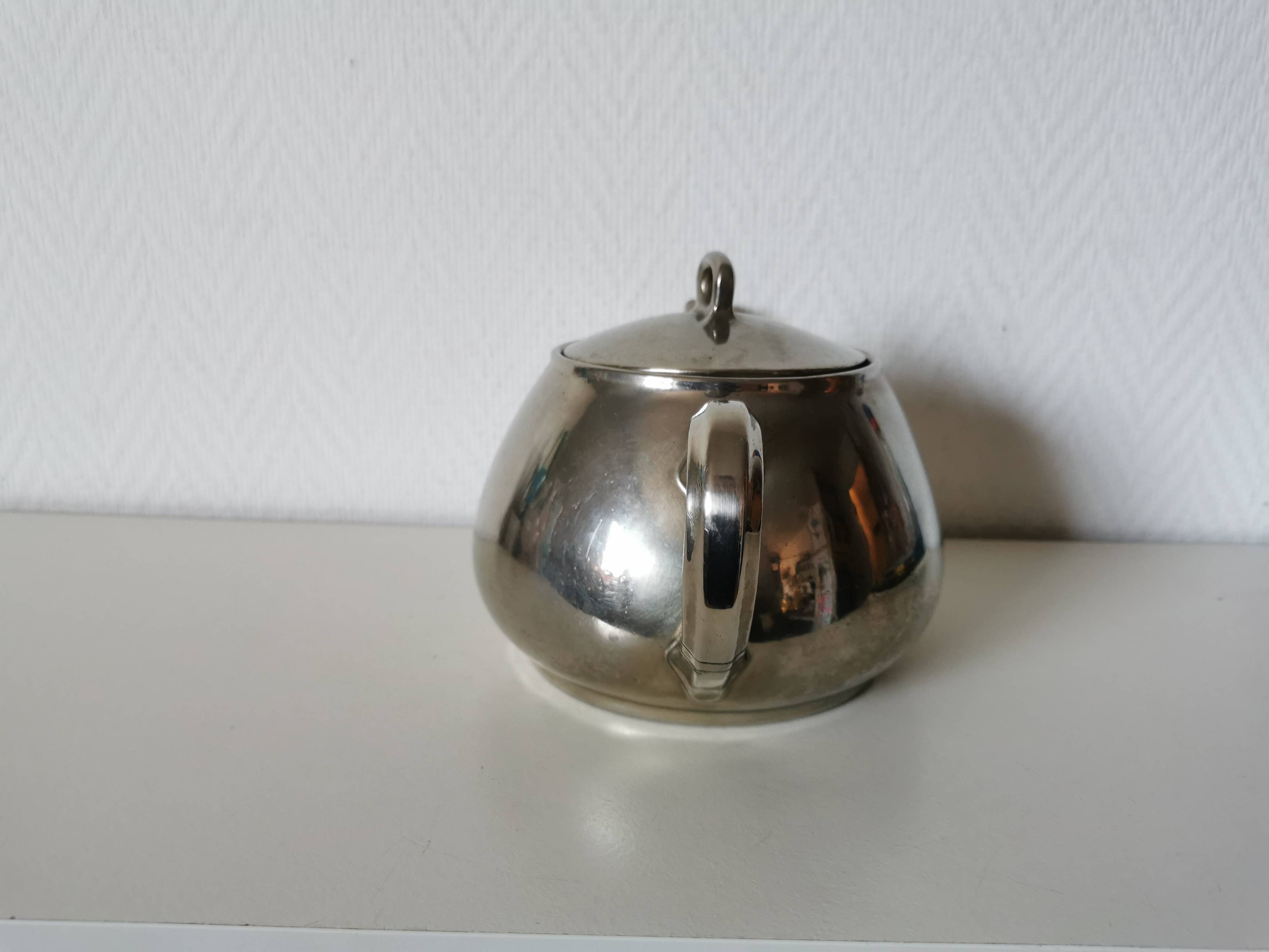 vintage teapot covered with silver metal