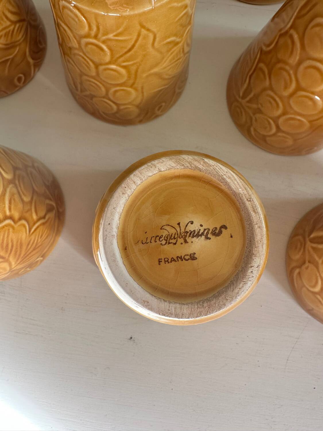 Set of 12 ochre Chavaillon de Sarreguemines cups