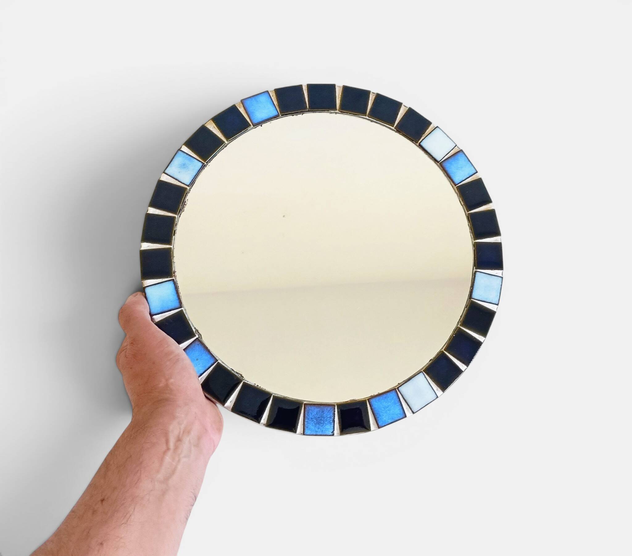 Round mosaic mirror in the style of Vallauris, France circa 1970.