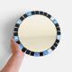 Round mosaic mirror in the style of Vallauris, France circa 1970.