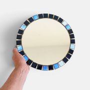 Round mosaic mirror in the style of Vallauris, France circa 1970.