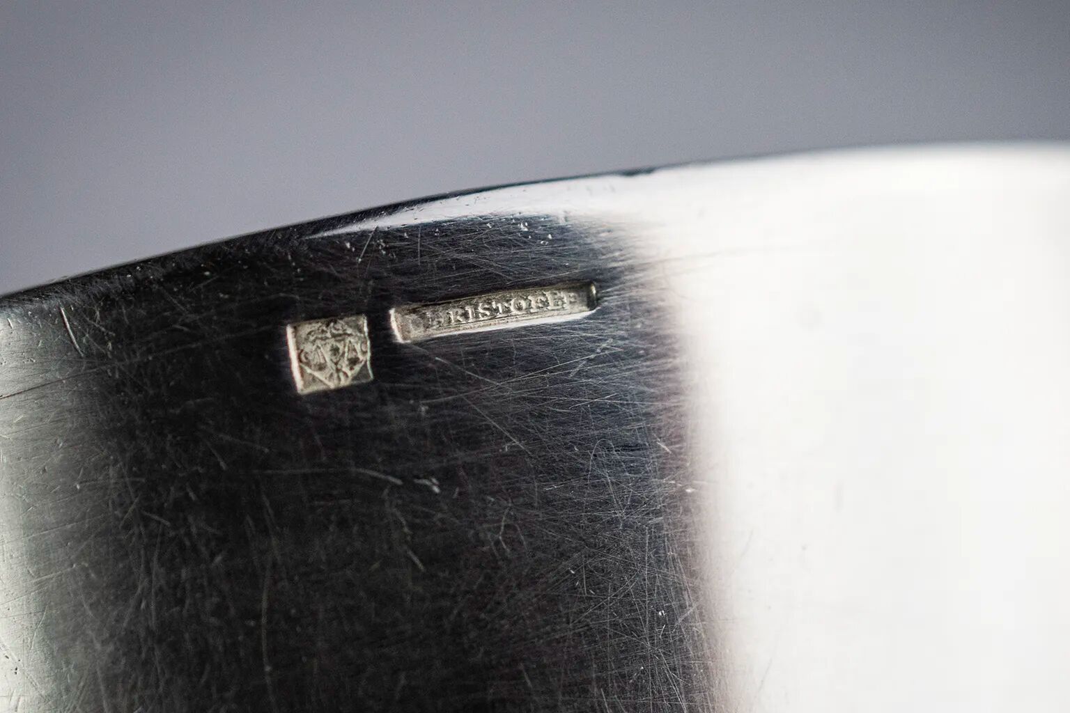 Four silver-plated Christofle egg cups with fluted sides.