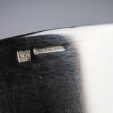 Four silver-plated Christofle egg cups with fluted sides.