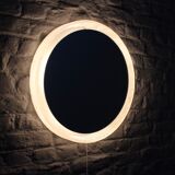 Bright round mirror in plexiglass
