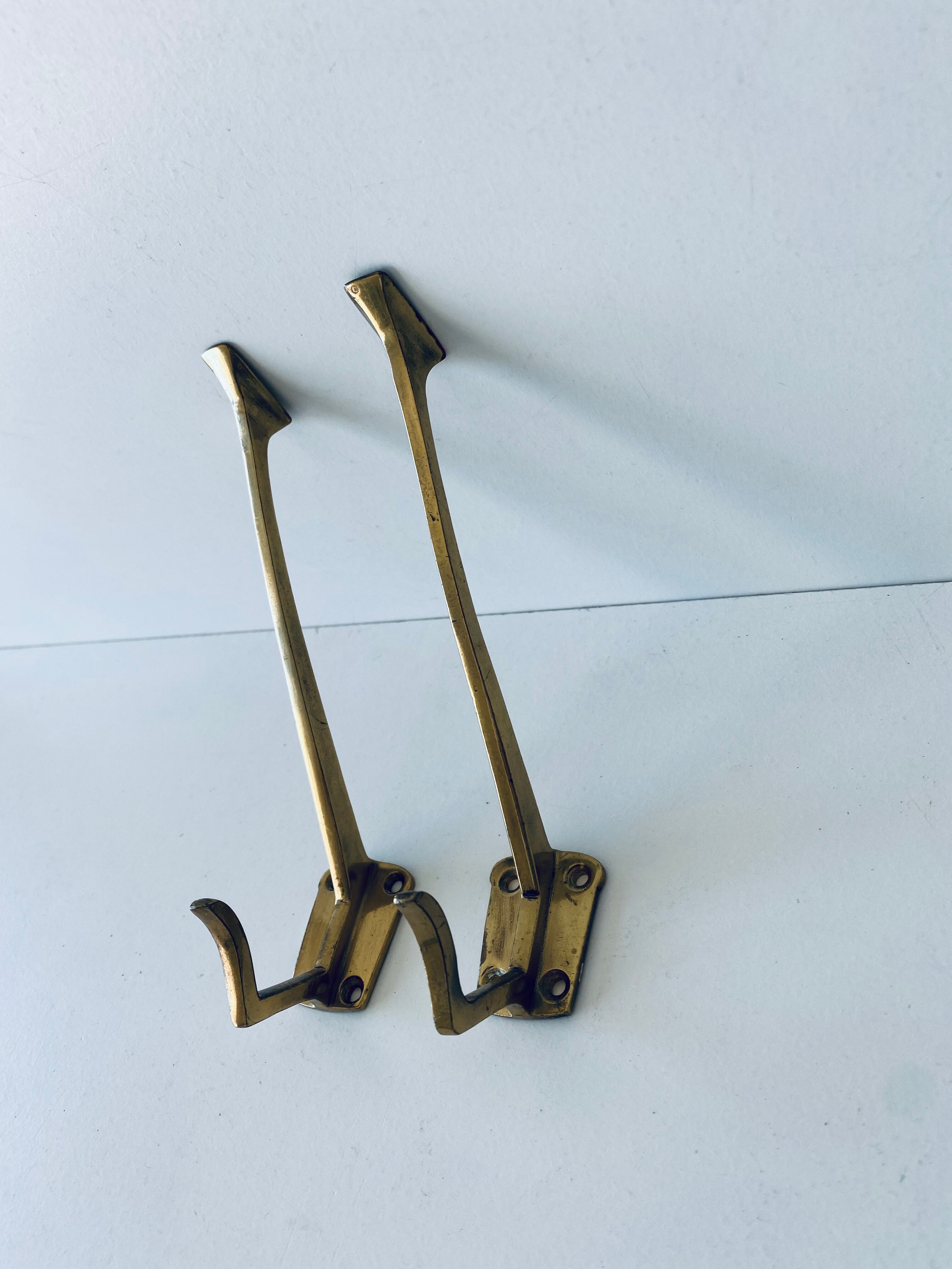 Pair of vintage brass hooks