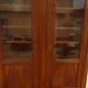 Chic old bookcase pegged in walnut with two glass doors and 5 shelves – Very good condition