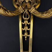 Large pair of gilt bronze wall sconces in the Louis XVI style.