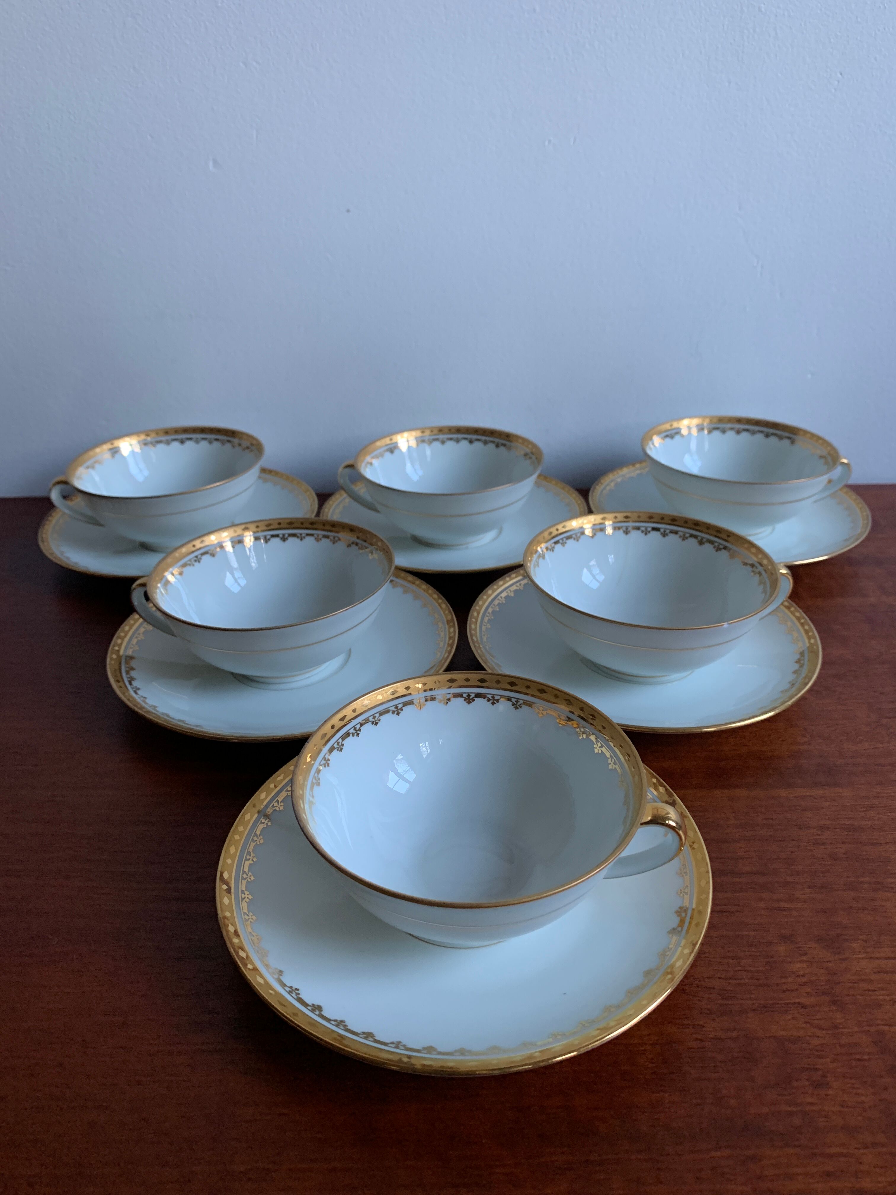 6 cups and golden porcelain saucers