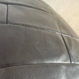 Pouf / Repose pied noir patchwork de cuir De Sede