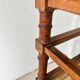 Antique banquette in Louis XIII style, turned wood with caning, late 19th to early 20th century.