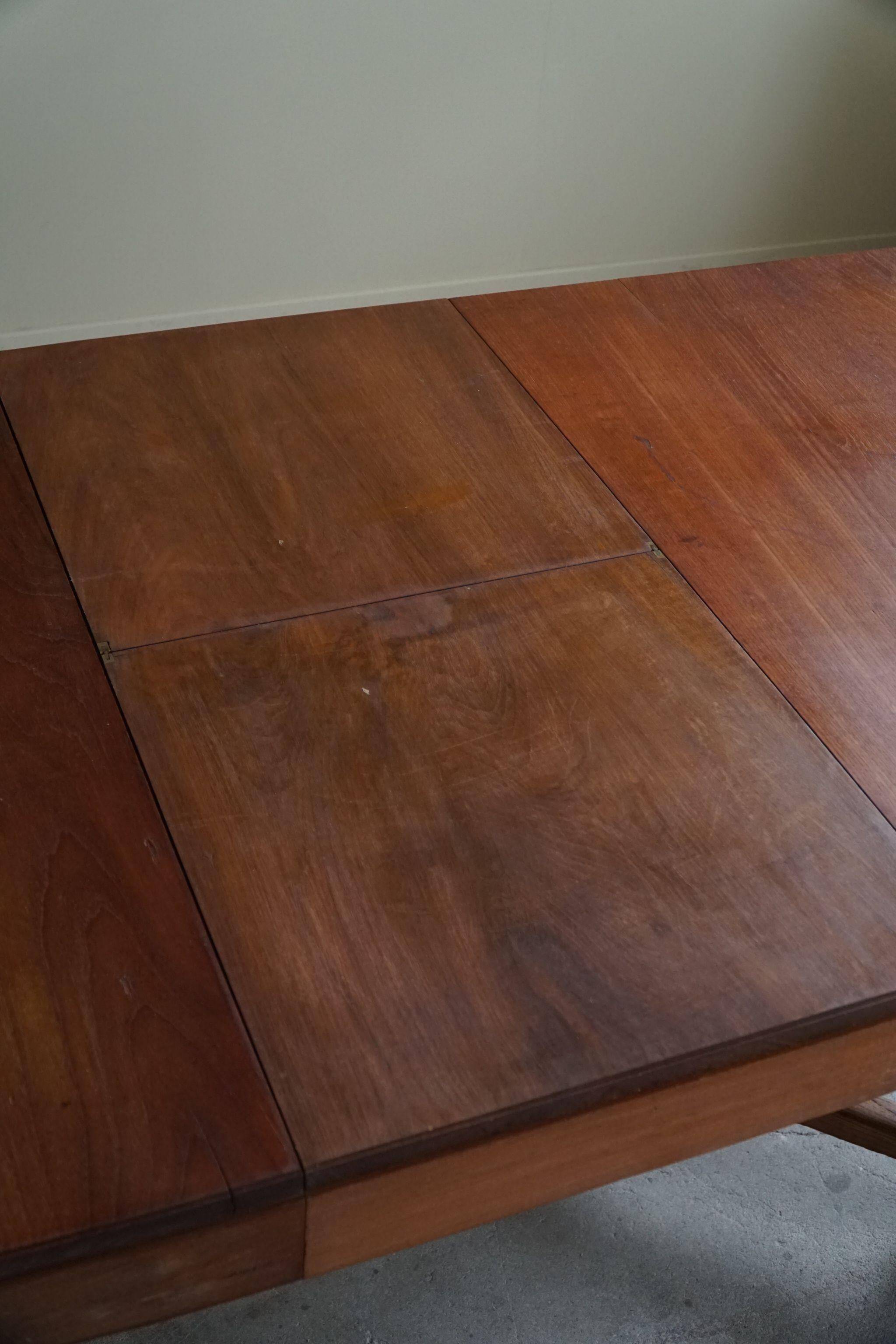 Art Deco dining table in teak, with butterfly extension, Danish cabinetmaker, 1940s.