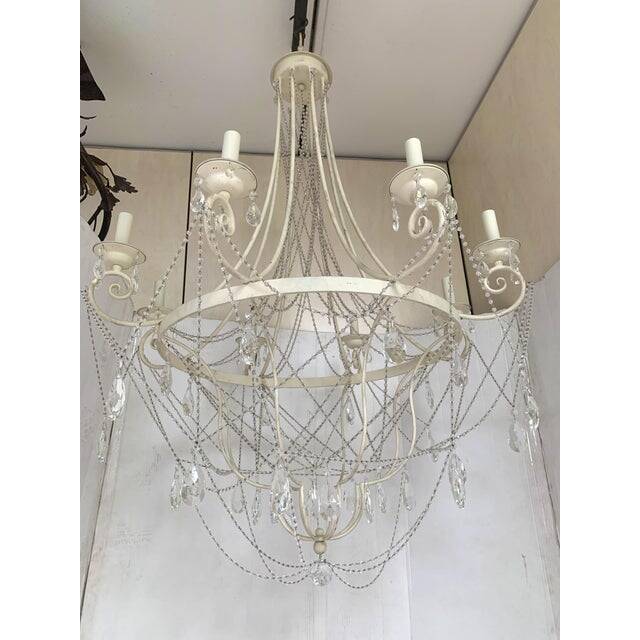 Contemporary ivory florentine iron and crystals chandelier
