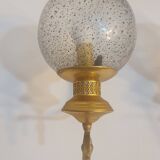 Pair of vintage gold wall sconces with transparent globes