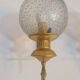 Pair of vintage gold wall sconces with transparent globes