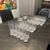 Set of 43 signed Daum crater glasses, an ice bucket, an ashtray,