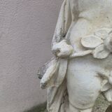 Antique reconstituted stone planter depicting a cherub