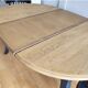 Antique extendable round table with Louis XV style extension