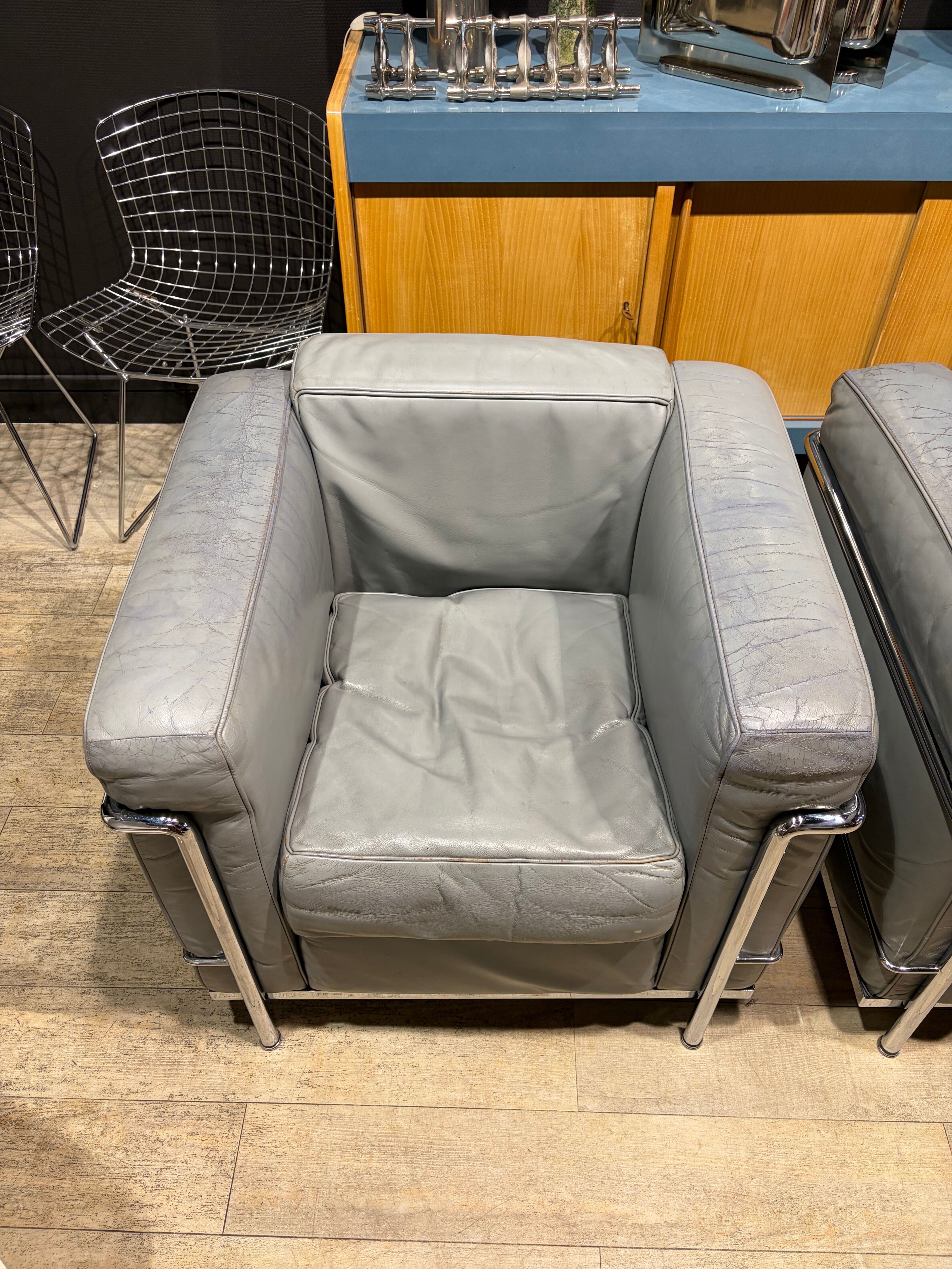 Pair of Cassina LC2 armchairs in grey leather.