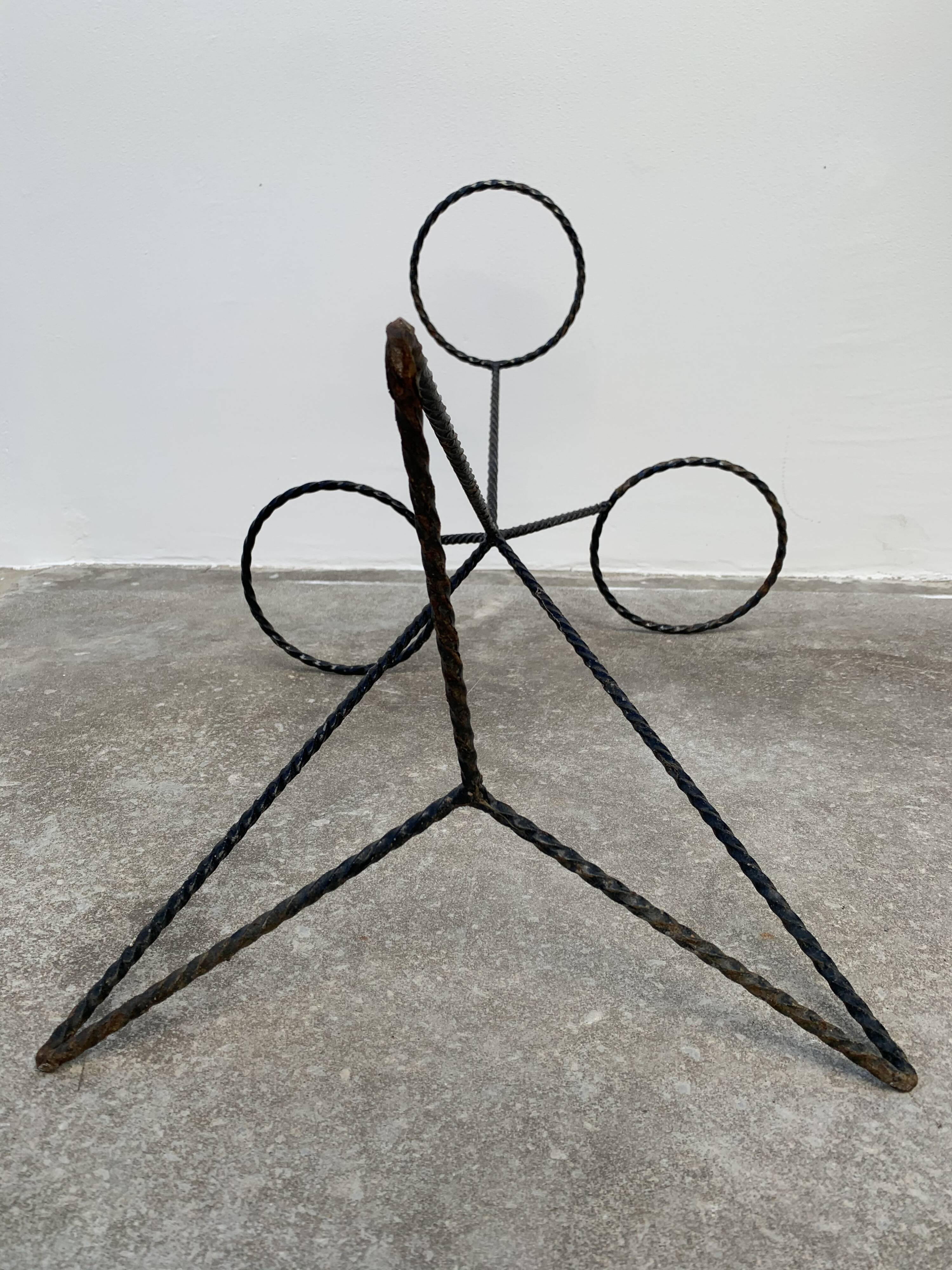 Black metal tripod plant holder