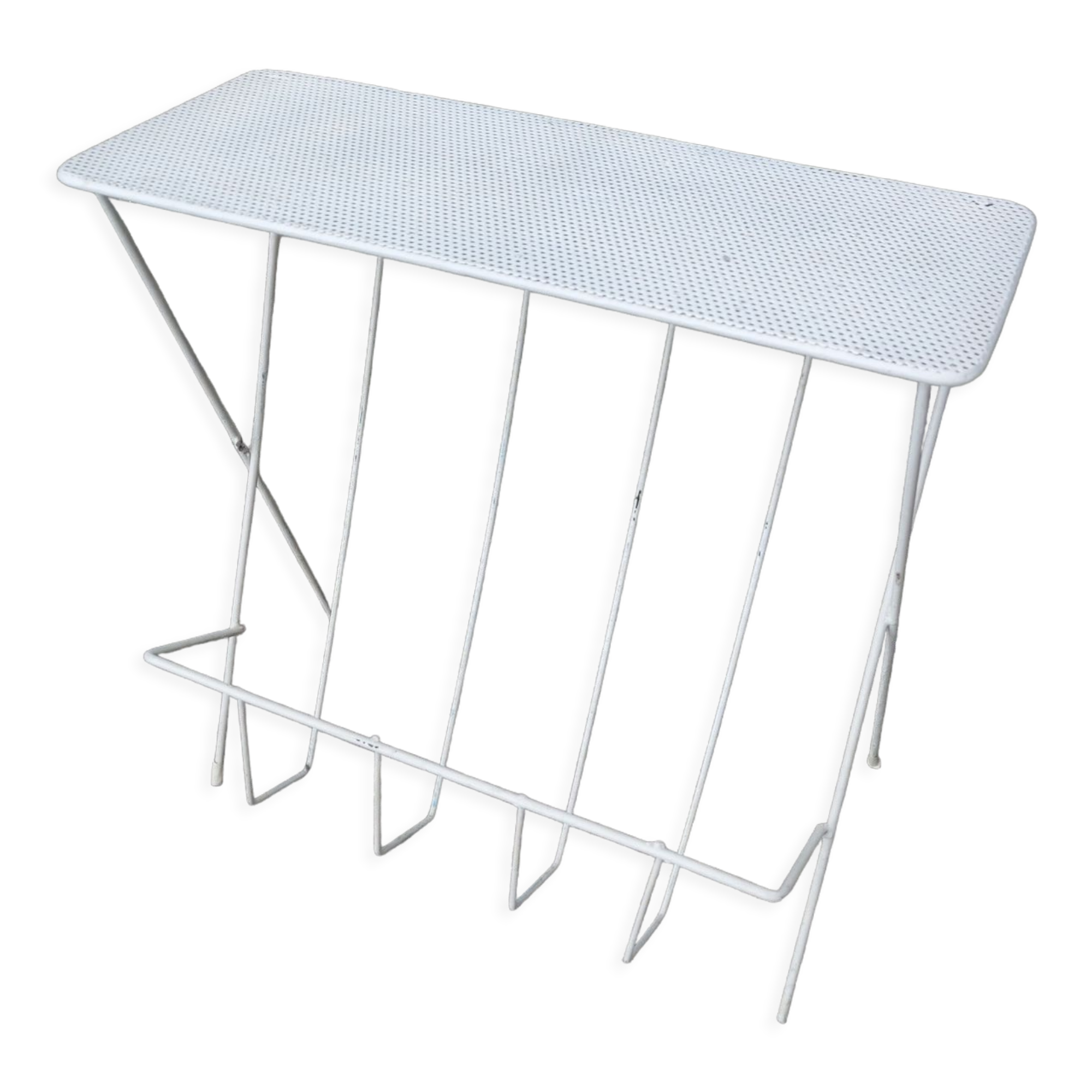 Vintage magazine holder in perforated metal