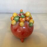 Small tripod vase with multicolored marbles