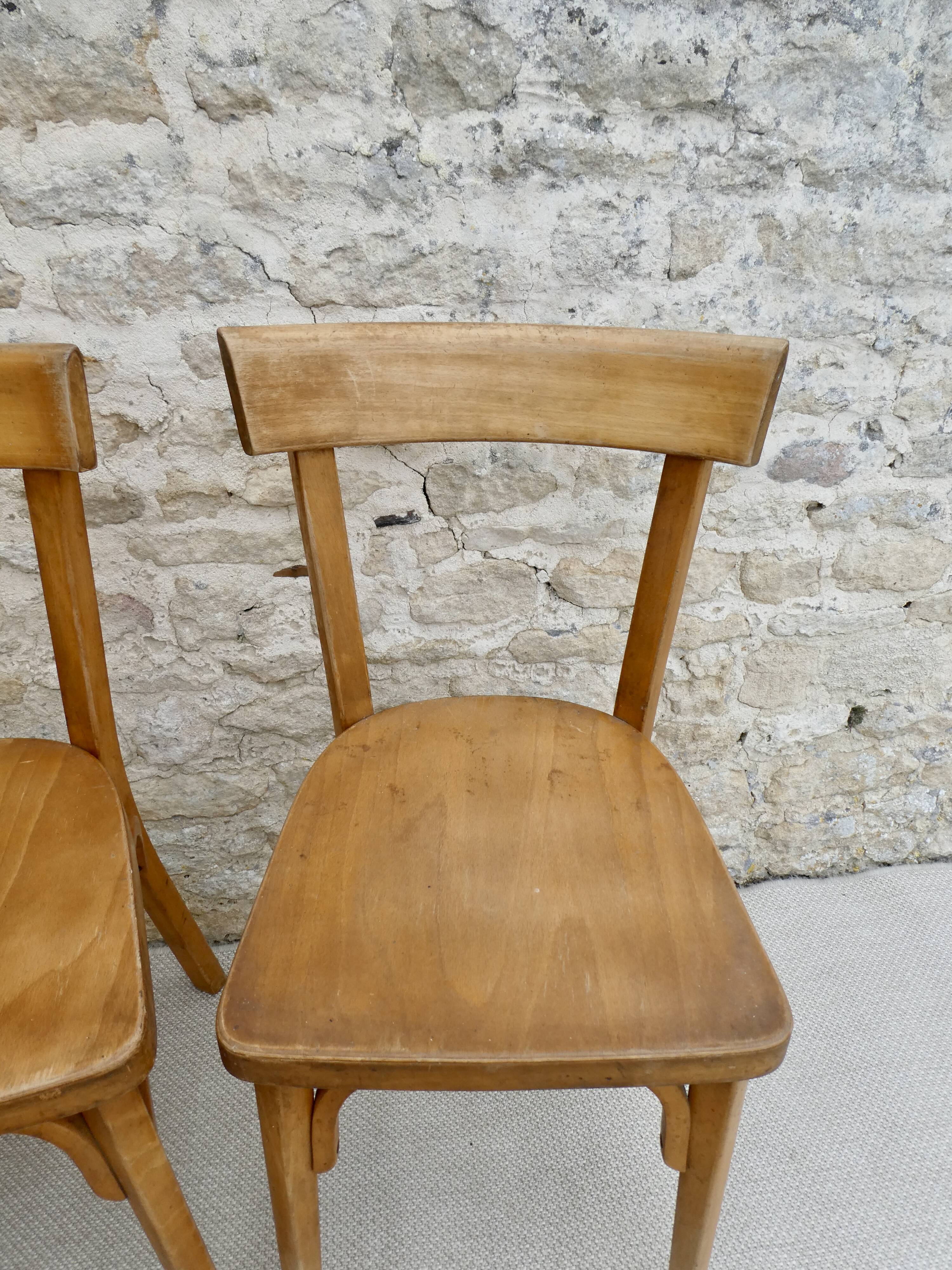 Pair of Baumann bistro chairs in light wood