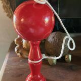 Large red wooden cup-and-ball game, 9 cm in diameter.