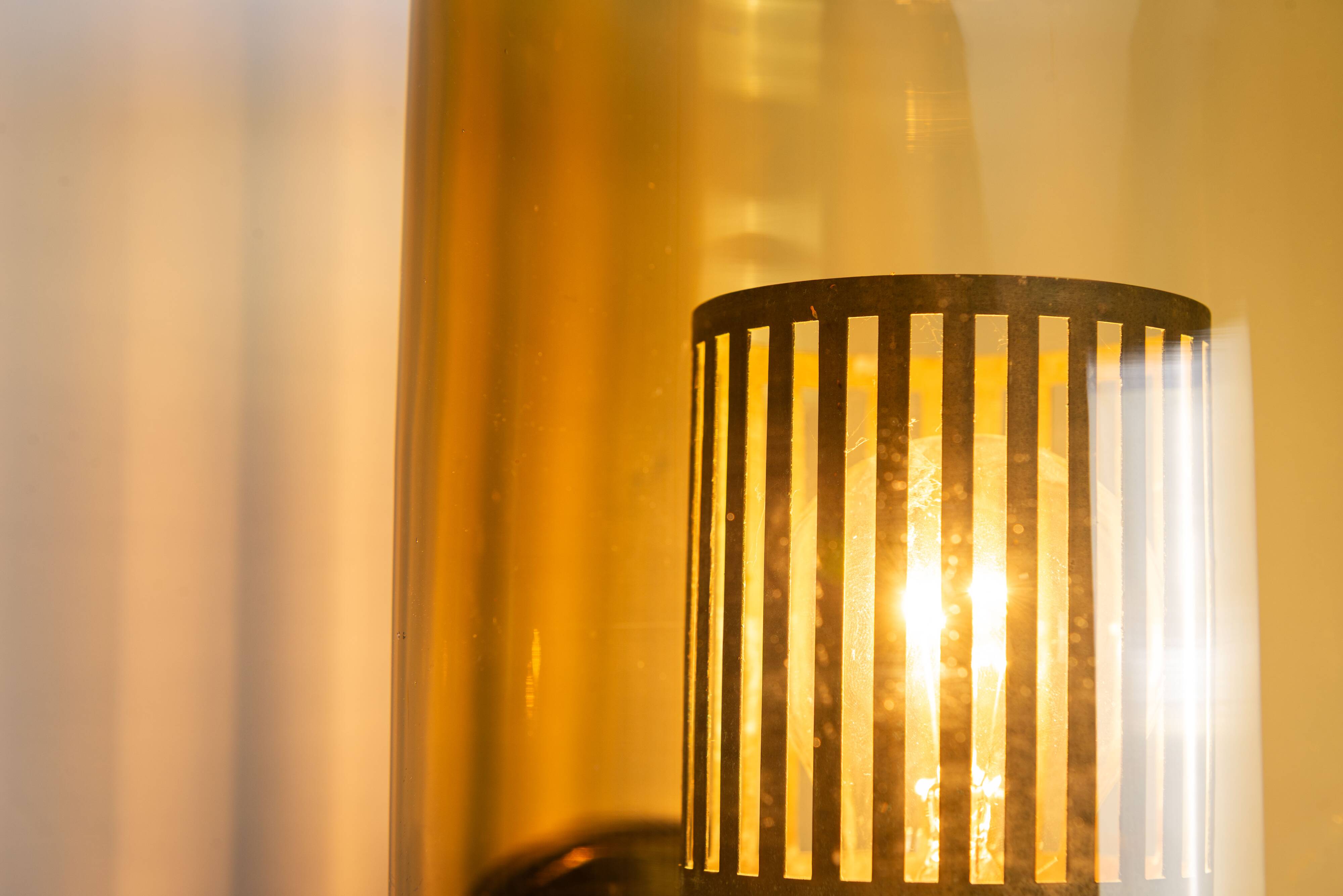 Pair of black metal wall lamps with yellow shades and inner diffuser