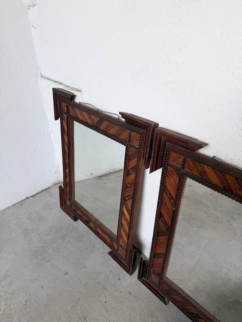 Pair of wooden mirrors in tramp art style