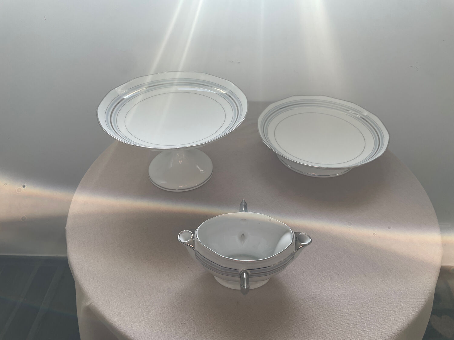 Antique white French porcelain sauce boat M&S with silver trim.