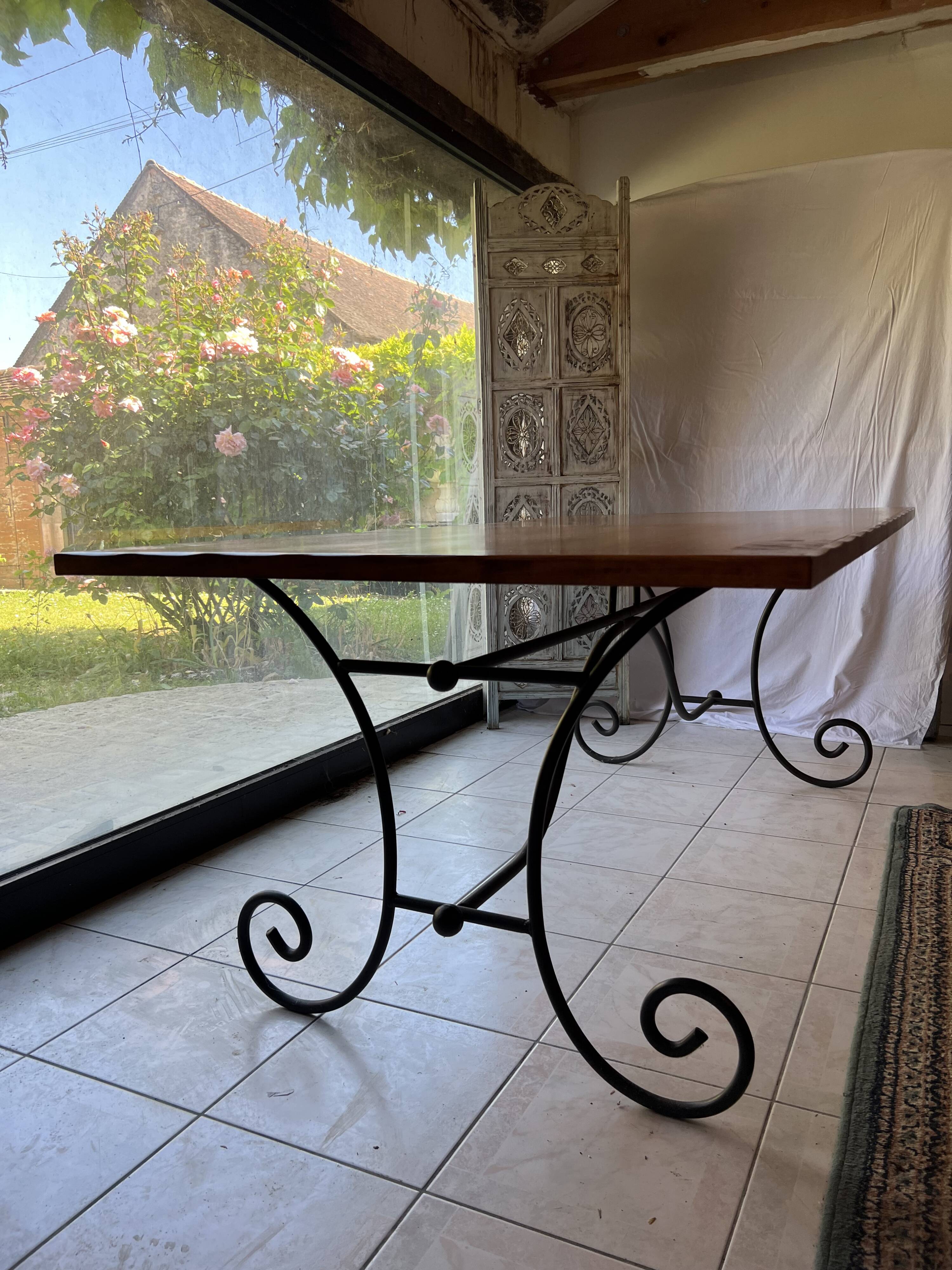 Large table with wrought iron legs