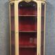 Curved display cabinet in Louis XV style, in cream lacquered wood enhanced with gilding.