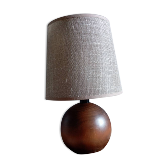 Bedside lamp with dark wood ball base, beige linen lampshade