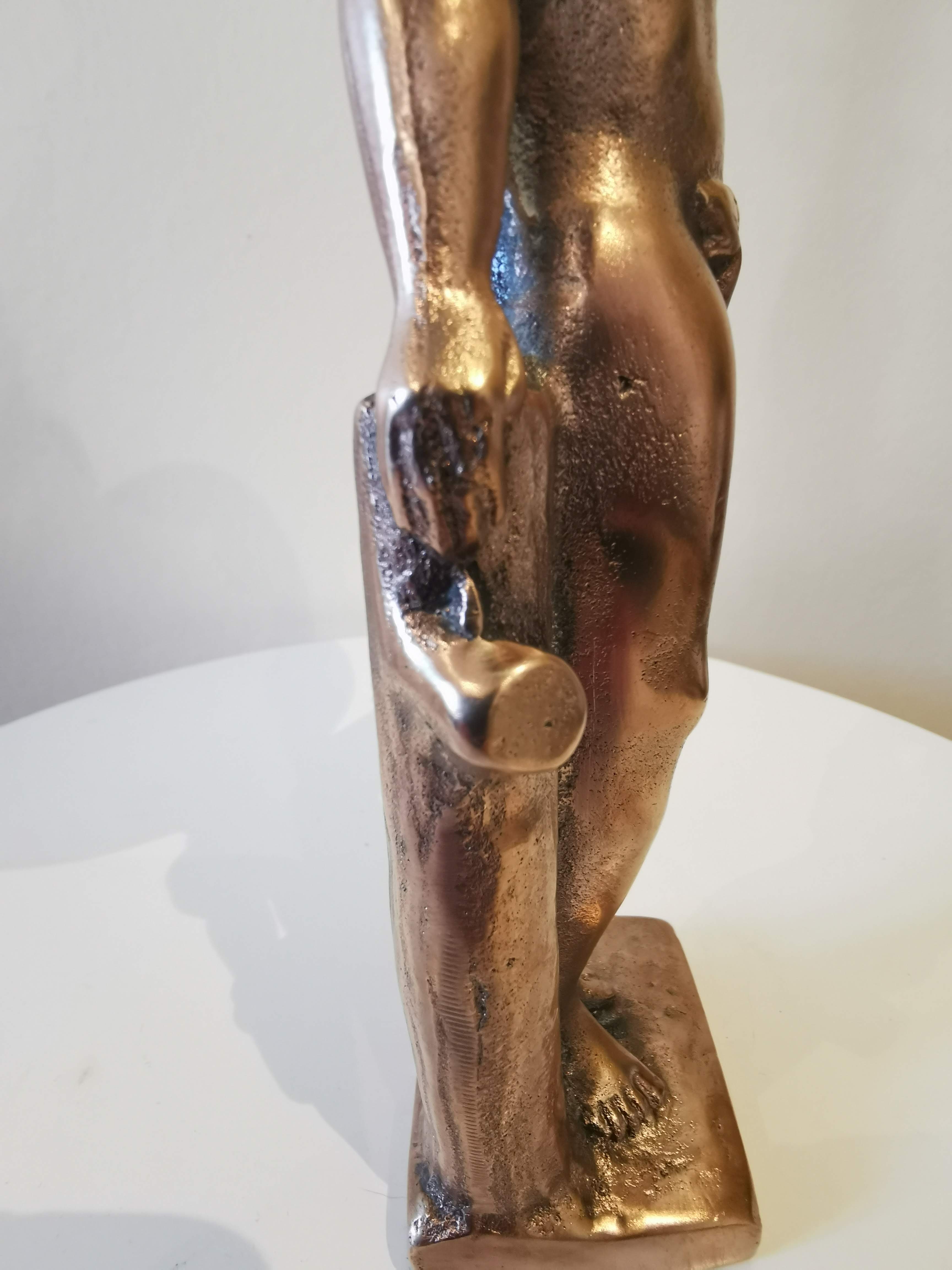 Large kerosene lamp mounted on bronze statue. Late nineteenth century