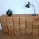 Industrial or apothecary workbench with 30 vintage wooden drawers.