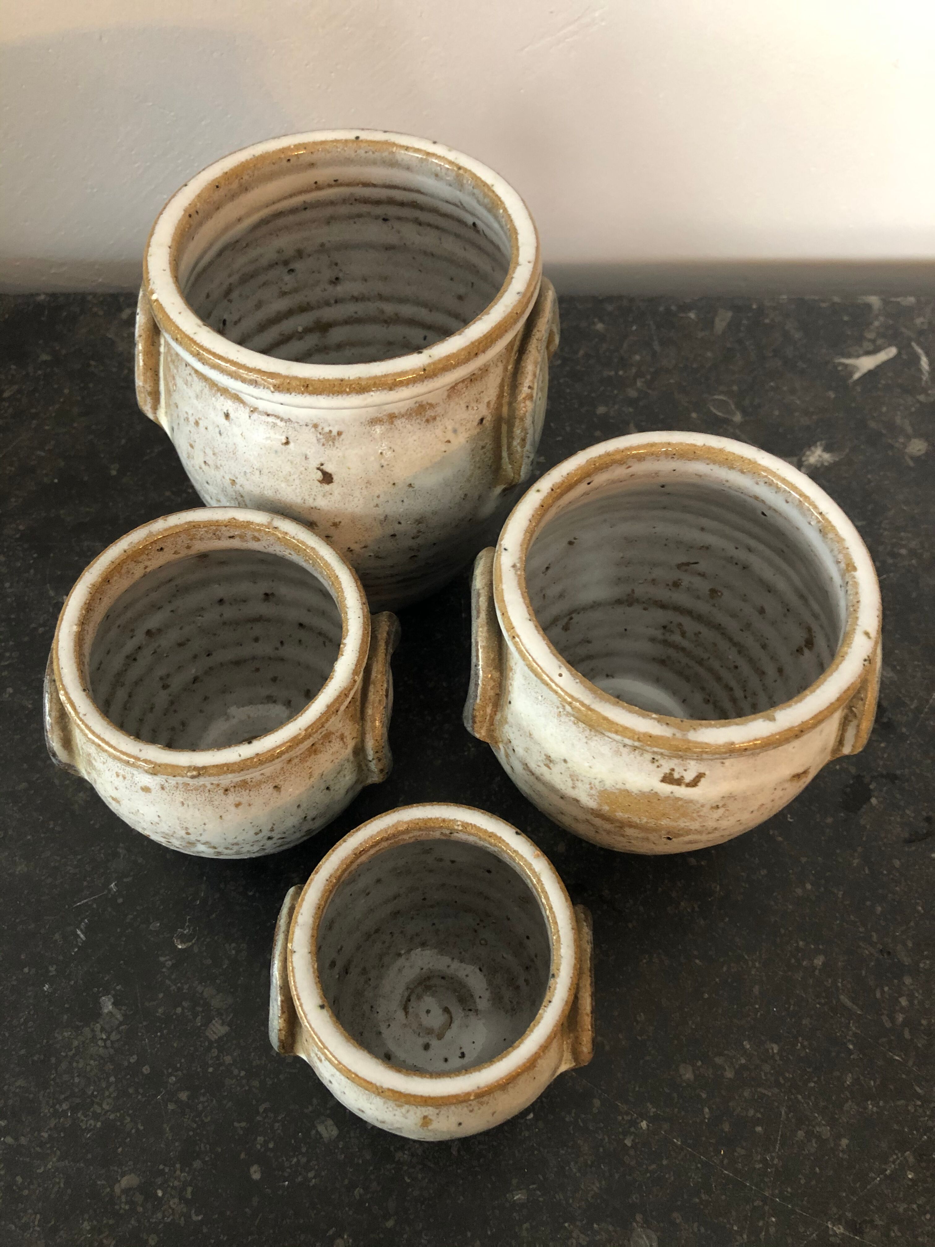 Set of 4 enamelled sandstone pots