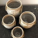 Set of 4 enamelled sandstone pots