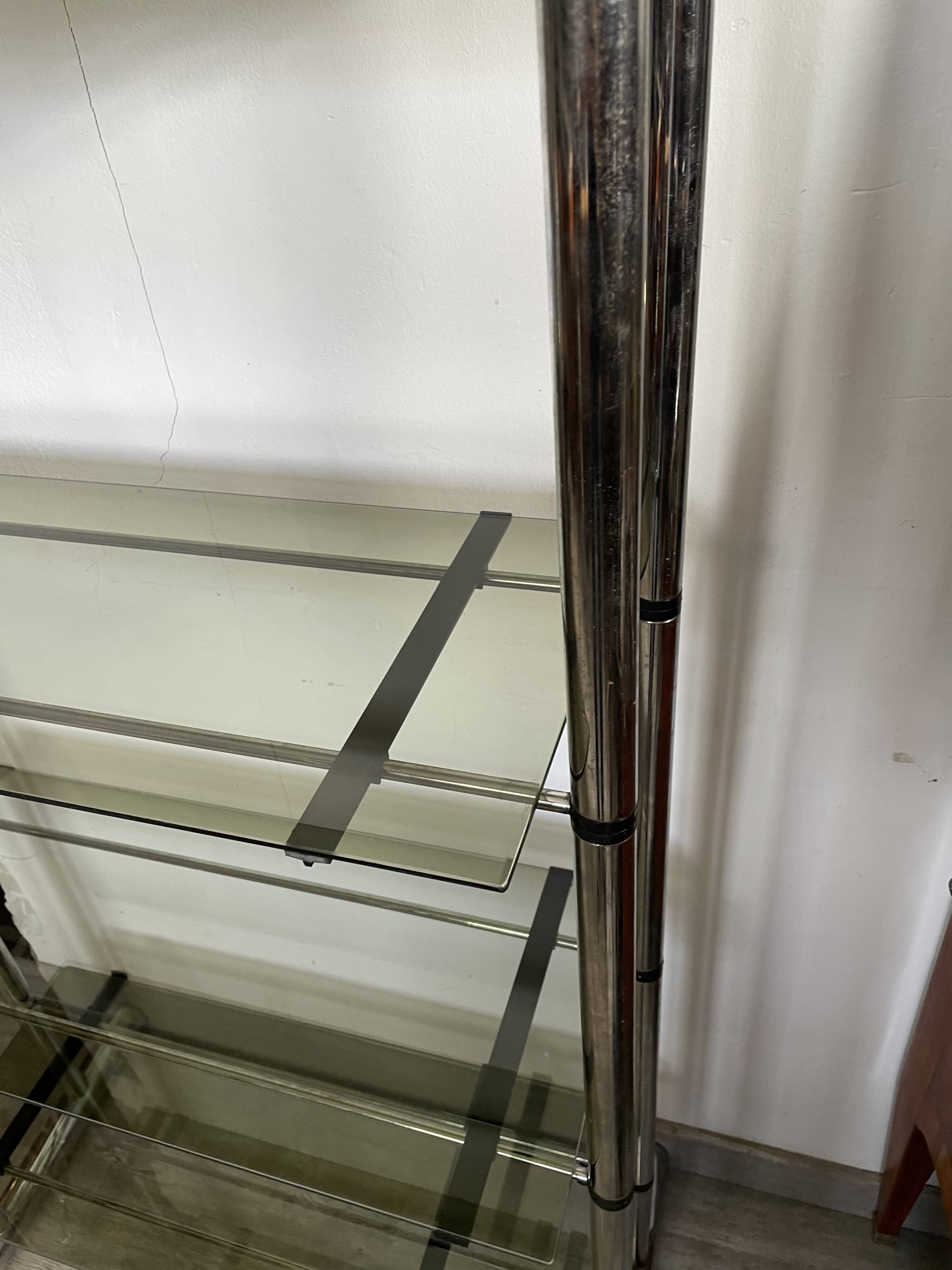Chromed metal tubular shelf with smoked glass.