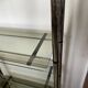 Chromed metal tubular shelf with smoked glass.