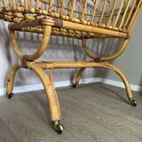 Wicker and rattan baby bed cradle with sail hoops on wheels
