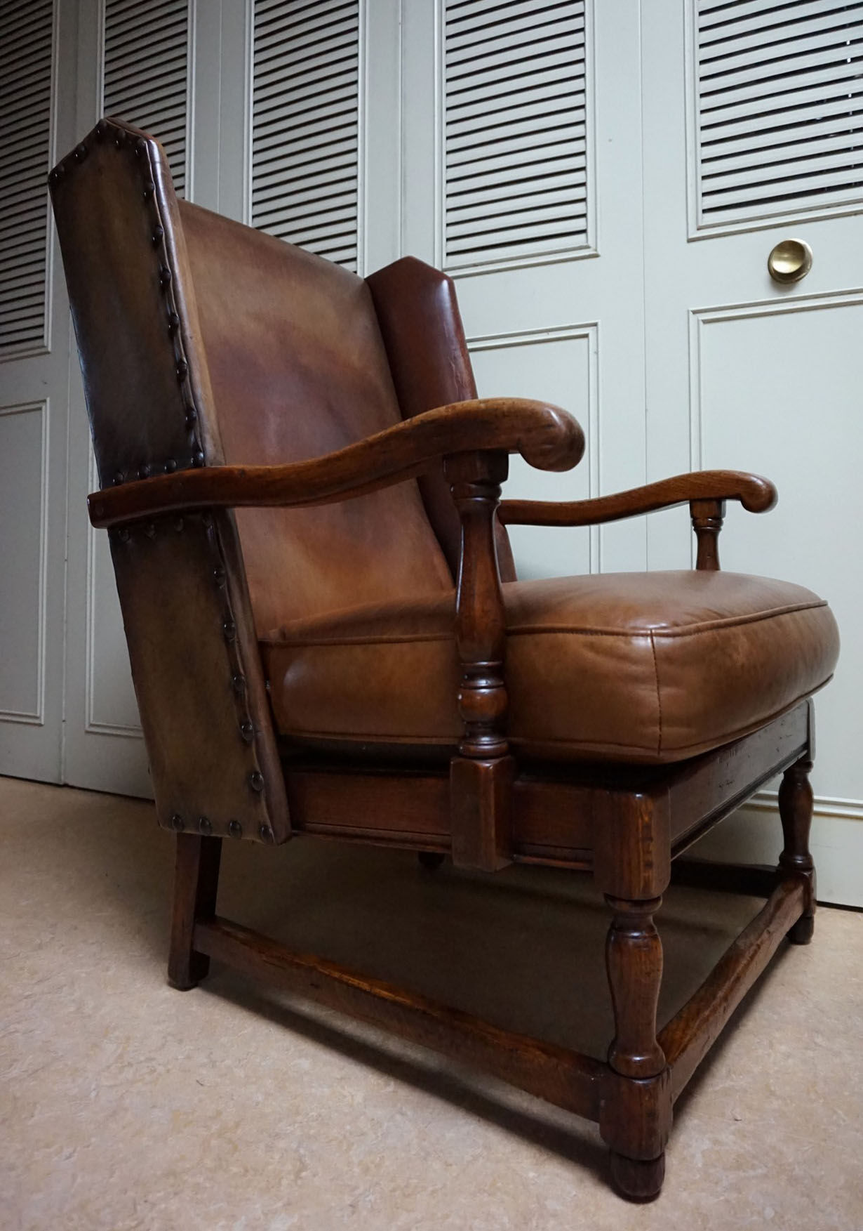 English high back cognac leather wingchair by Criterion cord