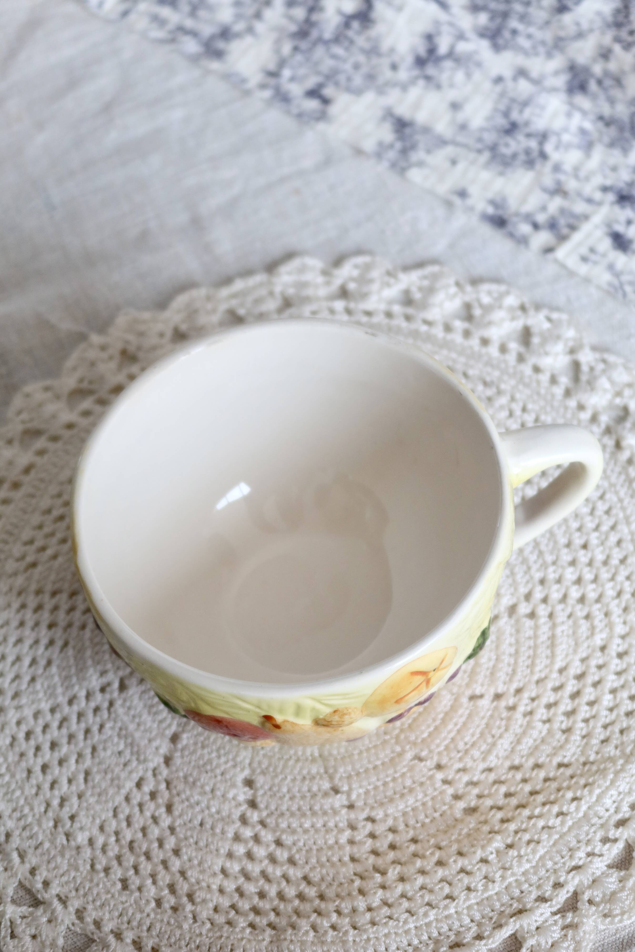 Large vintage earthenware mug with fruit motif and slip details