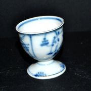 Antique porcelain diabolo egg cup with blue hand-painted onion decoration