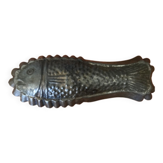 Old cake mold or chocolate fish